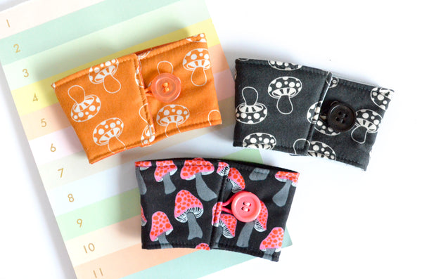 Black & Orange Mushroom Coffee Sleeve